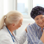 Woman after chemotherapy visiting doctor in hospital - most common types of cancer featured image