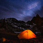 glowy tent under the stars at night