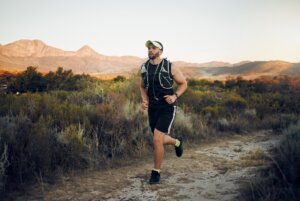 Male runner on nature trails how to train for a backpacking trip