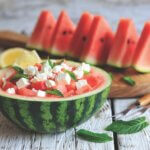 watermelon salad with feta served in watermelon healthy summer recipes featured image